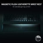 "Razer Huntsman V2 Optical Gaming Keyboard positioned in a gaming setup, showcasing its compatibility with various devices."
