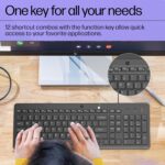 "HP 150 Wired Keyboard in a desktop setup, demonstrating its ergonomic design, full-size layout, and user-friendly shortcut keys for efficient workflow."