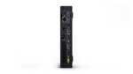 "Lenovo ThinkCentre M700 Mini PC set up in a minimal workspace, showcasing its space-saving design."